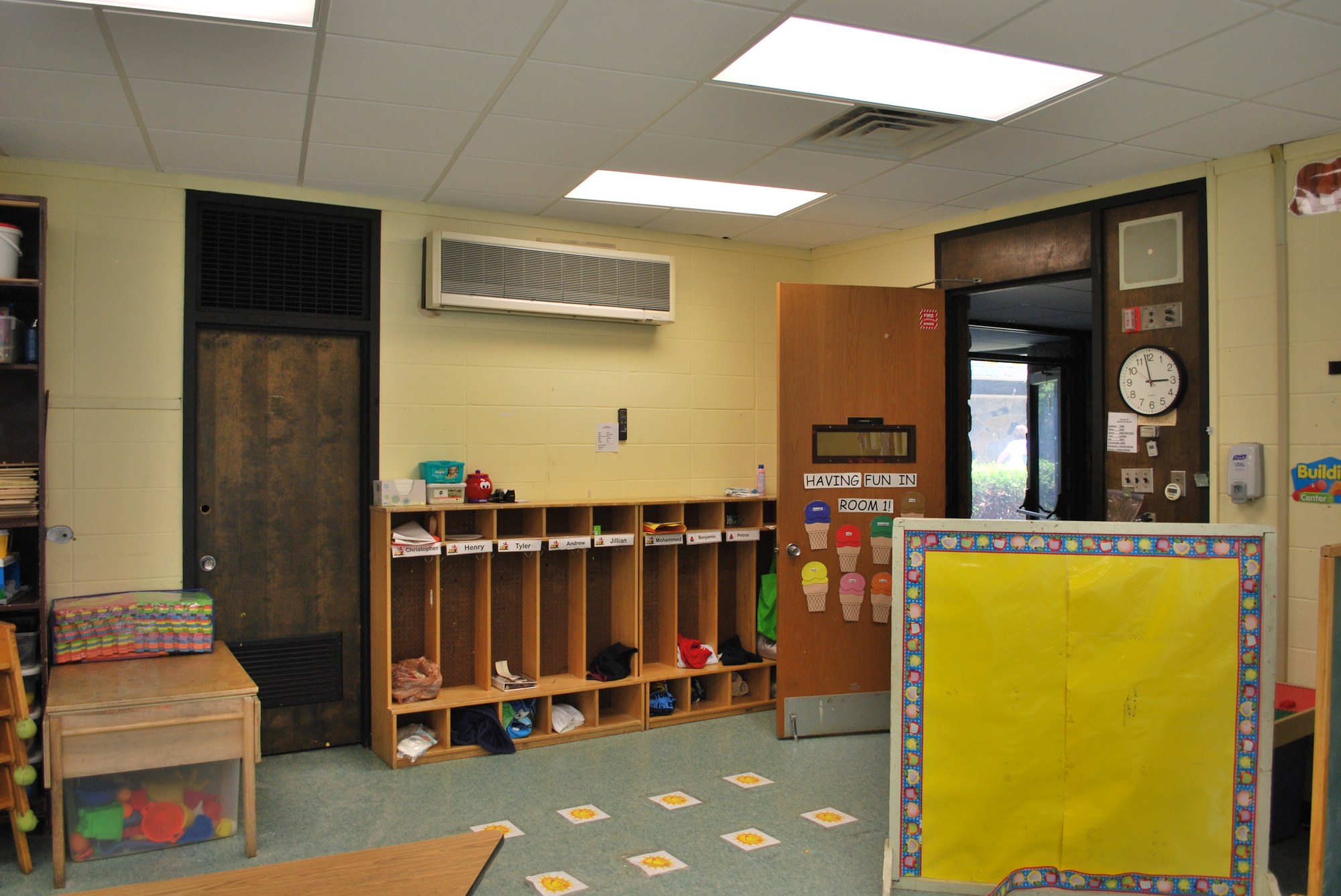 Inside a Mill Neck Manor School classroom with student cubbies and a vibrant, organized learning space